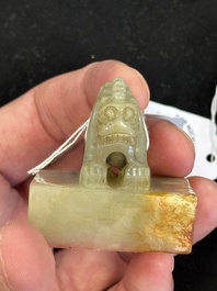A Chinese celadon and russet jade 'dragon' seal, 18/19th C.