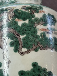 A fine Chinese famille verte 'Sanxing' rouleau vase with a gilt-bronze mount, Qing