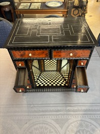 A small tortoiseshell-veneered cabinet of drawers with mirrored interior, Antwerp, 17th C.