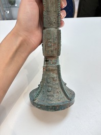 A Chinese archaic bronze wine vessel with 'taotie' design, 'gu 觚', Shang