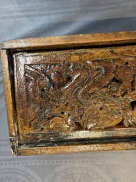 Two Tibetan polychromed wooden folding tables with dragon design, 19/20th C.