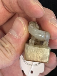 A Chinese celadon and russet jade 'chilong' seal, 18/19th C.
