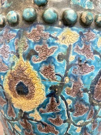A Chinese Fahua barrel-shaped 'lotus scroll' stool with incised design, Ming