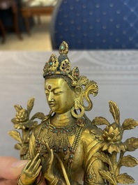A fine Sino-Tibetan turquoise- and coral-inlaid gilt-bronze Buddha Maitreya, Kangxi