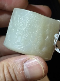 A fine Chinese white jade inscribed archer ring, Zigang 子岡 mark, 18th C.