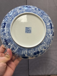 A Chinese blue and white 'lotus pond' plate, Qianlong mark, 19/20th C.