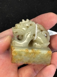 A Chinese celadon and russet jade 'dragon' seal, 18/19th C.