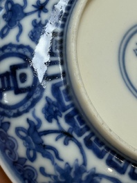 A pair of Chinese blue and white saucer dishes, Qianlong mark, 19th C.