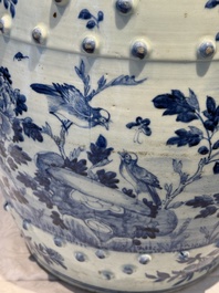 A Chinese blue and white 'birds among flowering branches' garden seat, 19th C.