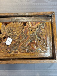 Two Tibetan polychromed wooden folding tables with dragon design, 19/20th C.