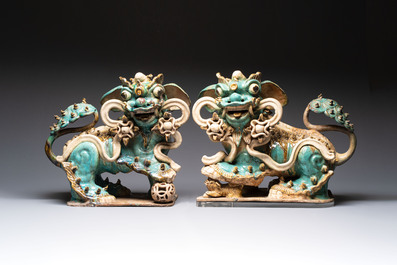 A pair of large Chinese polychrome-glazed Shiwan stoneware Buddhist lions, 19th C.