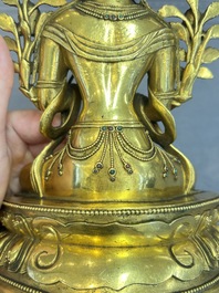 A fine Sino-Tibetan turquoise- and coral-inlaid gilt-bronze Buddha Maitreya, Kangxi