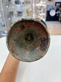 A Chinese archaic bronze wine vessel with 'taotie' design, 'gu 觚', Shang