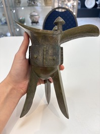 A Chinese archaic bronze wine vessel, 'jue 爵', late Shang