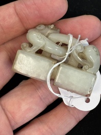 A Chinese celadon and russet jade 'chilong' seal, 18/19th C.