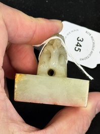 A Chinese celadon and russet jade 'dragon' seal, 18/19th C.
