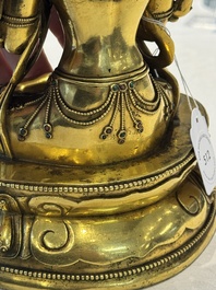 A fine Sino-Tibetan turquoise- and coral-inlaid gilt-bronze Buddha Maitreya, Kangxi