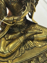 A fine Sino-Tibetan turquoise- and coral-inlaid gilt-bronze Buddha Maitreya, Kangxi