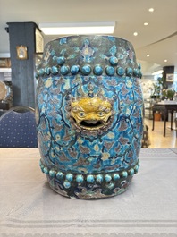 A Chinese Fahua barrel-shaped 'lotus scroll' stool with incised design, Ming
