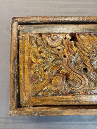 Two Tibetan polychromed wooden folding tables with dragon design, 19/20th C.