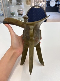 A Chinese archaic bronze wine vessel, 'jue 爵', late Shang