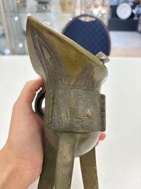 A Chinese archaic bronze wine vessel, 'jue 爵', late Shang