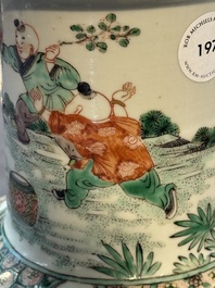 A fine Chinese famille verte 'Sanxing' rouleau vase with a gilt-bronze mount, Qing