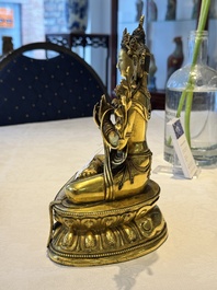 A fine Sino-Tibetan turquoise- and coral-inlaid gilt-bronze Buddha Maitreya, Kangxi
