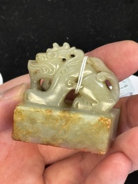 A Chinese celadon and russet jade 'dragon' seal, 18/19th C.