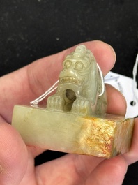 A Chinese celadon and russet jade 'dragon' seal, 18/19th C.