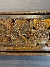 Two Tibetan polychromed wooden folding tables with dragon design, 19/20th C.