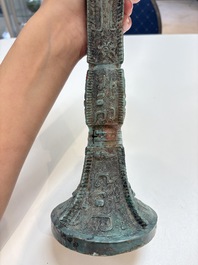 A Chinese archaic bronze wine vessel with 'taotie' design, 'gu 觚', Shang