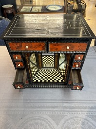 A small tortoiseshell-veneered cabinet of drawers with mirrored interior, Antwerp, 17th C.