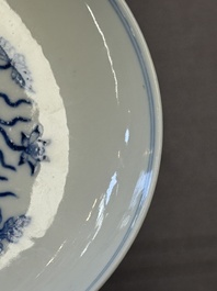 A Chinese blue and white 'lotus pond' plate, Qianlong mark, 19/20th C.