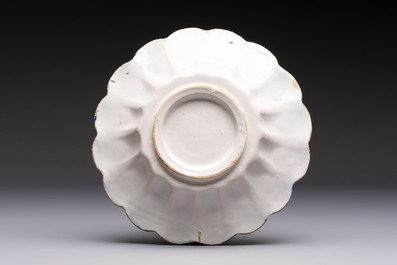 A small polychrome lobed Dutch Delft dish with floral design, 17th C.