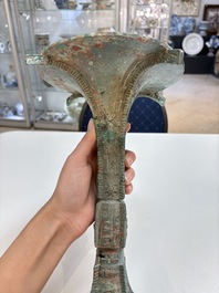 A Chinese archaic bronze wine vessel with 'taotie' design, 'gu 觚', Shang