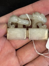 A Chinese celadon and russet jade 'chilong' seal, 18/19th C.