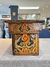 Two Tibetan polychromed wooden folding tables with dragon design, 19/20th C.