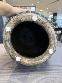 A Chinese Fahua barrel-shaped 'lotus scroll' stool with incised design, Ming