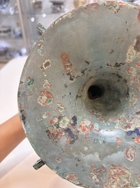A Chinese archaic bronze wine vessel with 'taotie' design, 'gu 觚', Shang