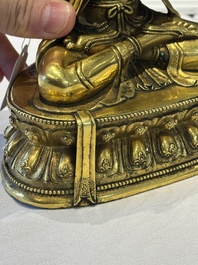 A fine Sino-Tibetan turquoise- and coral-inlaid gilt-bronze Buddha Maitreya, Kangxi