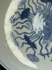 A Chinese blue and white 'lotus pond' plate, Qianlong mark, 19/20th C.