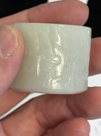 A fine Chinese white jade inscribed archer ring, Zigang 子岡 mark, 18th C.