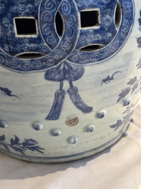 A Chinese blue and white 'birds among flowering branches' garden seat, 19th C.