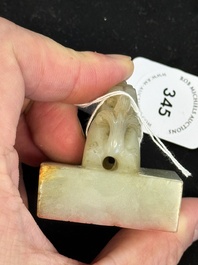 A Chinese celadon and russet jade 'dragon' seal, 18/19th C.