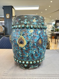 A Chinese Fahua barrel-shaped 'lotus scroll' stool with incised design, Ming