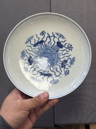 A Chinese blue and white 'lotus pond' plate, Qianlong mark, 19/20th C.