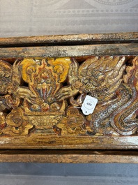 Two Tibetan polychromed wooden folding tables with dragon design, 19/20th C.