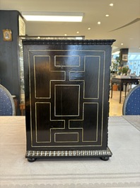 A small tortoiseshell-veneered cabinet of drawers with mirrored interior, Antwerp, 17th C.