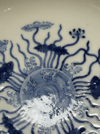 A Chinese blue and white 'lotus pond' plate, Qianlong mark, 19/20th C.